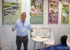 Juan Carlos Gallon of Oboya with the machine that can pull/transport hundreds of kilos of harvested flowers, as well as bananas, through the greenhouse.