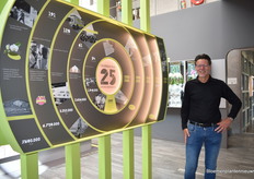 Marco Hendriks, co-owner of Optiflor. This year, the company is celebrating its 25th anniversary and at this display, the developments and achievements per 5 years are presented.