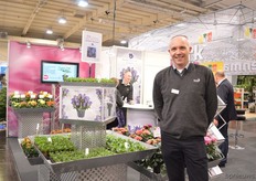 Annette Steinhaven and Ken Rynearson of Poulsen Roser, standing next to their new cyclamen and potted roses varieties.