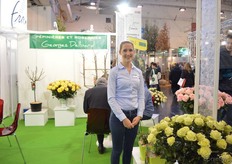 Corina Fischer of Georges Delbard. She is helping her mother (behind her in a meeting with visitors) at the booth.