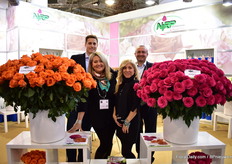 Team of NIRP International. Copacabana (orange rose on the left) and Hotspot (pink rose on the right) take center stage at their booth. Both varieties are doing well in Kenya and South America.
