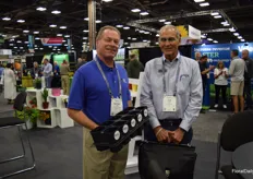 Darden Jones with Summit Plastic Company shows the JānorPot® 3D Systems® and Tray, (which because of the shape of the pots always will be forward facing) to Joe Fox from MasterTag.