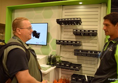 Sam Janicki with TO Plastics talking to Homer Trecartin from Twicewood Nursery