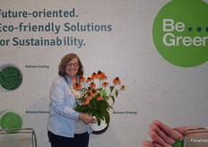 Jennifer Calhoun with Benary, holding an Echinacea Polly Nation. The flower is very uniform in habit and timing and has bold colors in single colors and mixes. It is available as Be Green Seed.