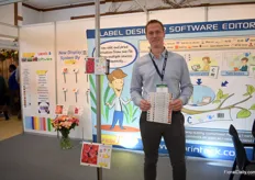 Matej Usenik of PrinTrack holding the loop label TF14, one of the us best selling products in Kenya for cut flowers. On the left you see a new system, windsafe system. See also the next picture. This system is used to hang the label, which are often in greenhouses and and on roles.