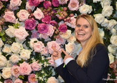 Our Elita Vellekoop in front of the rose wall of Alexandra Farms.