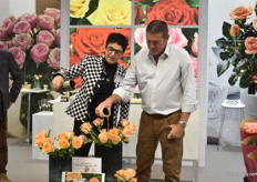 Rosa Eskelund of Roses Forever and Ivan Freeman of Uhuru Flowers in Kenya baptizing a new rose named after Ivan's mother, Rosa Loves Me Celebrating Heather.