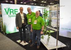 David Eygenraam with VRE Systems is showing their drying racks and is visited by Butch Tomasko & Randy Shipley with VividGro.