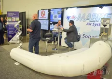 Dominic Paulhus with Mabre Canada explaining about their air systems to a client.