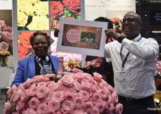 A new rose, Radiant Rebecca about to be baptized by Rebecca Kotut, owner of Karen Roses. In this picture is Andrew Wambua, managing director of Mzurrie Flowers, revealing the name 