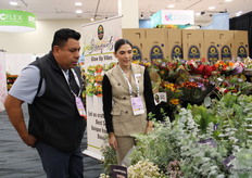 Ana Andrade, Sun Vista Farms talking to a visitor