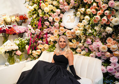 Alina Neasca in the booth of Alexandra Farms