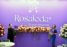 Karina Pallares and Mabel Alvarado from Floricola la Rosaleda S.A. showing their new "30 years blooming" logo
