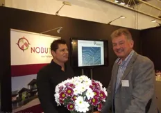 Who is presenting the flowers in the boot of Nobutec