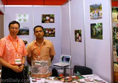 Suthee Ruhiwanitkul, Deputy Director or Bureau of Policy and Strategy for the Ministry of Public Health of Thailand and Mangosteen grower Anuwong Chang-U-Dom.