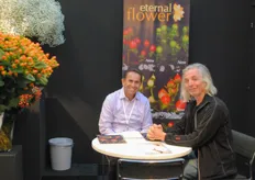 Adrián Moreano from Eternal Flower talking with a visitor.