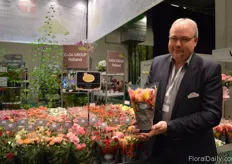 Henrik Boeriths of Rosa Danica holding the Rosaroma; a scented rose.