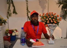 Simon Mwaura of Westlife Decorations & Floral Design with the Best Flower Arrangements Award.