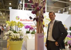 Rick Kroon of Anthura, breeder and propagator of phaleanopsis and anthurium. At the exhibition new varieties were presented. Kroon is standing next to the Maravilla, the new purple colored anthurium .
