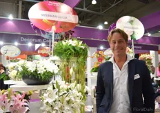 Jaap Moerman of Moerman at the Decorum stand. Moerman is one of the growers who is part of Decorum Company that have a booth at the show. He grows around 20 lily varieties in a 6.5 ha sized greenhouse in the Netherlands. The new lily that they are presenting here is the Roselily. This is a double flowered lily which does not have any staining pollen.