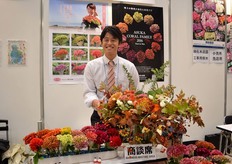 "Issei Yamaguchi of Asuken Co. For the third time, Yamaguchi is attending the IFEX. He grows oriental lilies and the "Asuka Coral Family". These are flowers that look like coral. he produces 400,000 coral flowers and 250,000 oriental lilies per month in a hoop house and a plastic greenhouse in Japan. At the show, he is presenting the coral flowers, which he also breeds. His current assortment consists of 20 colors. According to Yamaguchi, the green color is the most popular one and the orange color is increasing in popularity because of the increasing popularity of Halloween."