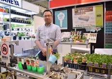 Soshin Ando of Ando Chemical. They supply pots and a labeling machine. This machine sticks the label to the pot.