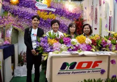 The team of Marketing Organization for Farmers. They are at the exhitbition to look for a market in Japan for their cut flower Orchid farmers.