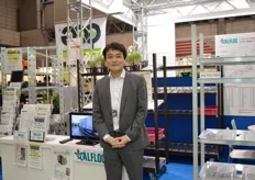 Ishii of Iwatani Materials standing next to the trolleys from Alfloc. Alfloc is part of the Iwatani Group.