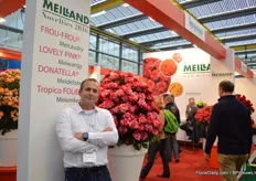 Matthias Meilland of Meilland International. He stands next to the Frou-Frou. This is their new introduction. It is a red rose with pink stripes.