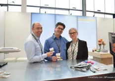 Boy van Dijk, Boris Lameiras and Luanna Lallerstedt of Lufthansa Cargo. They are holding sweets that look like trucks. These sweets promote the fact that they will open a truck line between Aalsmeer and Frankfurt.