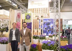 Erwin Giezen and Evelien Spaans of Moerheim New Plant. They are standing next to the new colors of their Senetti series. They introduced five new fluor colors.