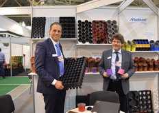 "Kees van Beek and Krysztof Banas of Modiform. Beek is holding a tray to propogate trees. According to him, more trees are being produced in Ukraine and by using a tray like this, the productivity can be increase. Banas is holding two colored pots. According to him, there is a growing demand from the consumers side for these pots, so the growers will follow. Using colored pots is quite new for Ukrainian growers. For Modiform, Ukraine is a potential market. "We see that the consumers really love flowers and plants and therefore we are positive regarding the improvement of the situation."