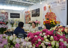 Cherry Nany of Waridi Line talking with a visitor.