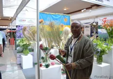 Francois in the booth of NAEB. In this booth of the Rwanda Government, three growers are presenting their products.