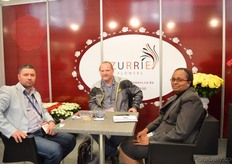 Irene Njeru of mZurrie Flowers talking with Russian visitors: Andrey Severgin and Aleksey Ganichkin of Volga Flowers.