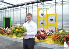 Jacob Schneider of Schneider Youngplants, holding the Nemesia Nebula Yellow. This is a seed raised variety that has greater flowers than the cutting raised varieties, like two times. Red and yellow are special colors.