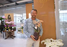 Eric Moor of Sion holding one of their new orchids with a fragrance.