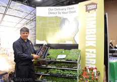 Tim Gibson of Timbuk Farms holding the acordion horticultural tray of Landmark plastic. They use the tray for their crops that need a little more space, like the begonias, geraniums and dahlias. They are also a Dümmen Orange rooting station.