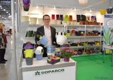 "Adrien Cohu of Soparco holding a new line of hanging baskets. "It is a strong light weigth container. Hopefully it will compete with the containers from the Russian manufacturers", he says."