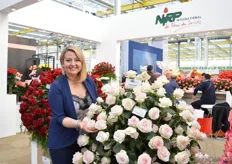 Deborah Giohne of NIRP International next to the Ragazza. A light creme colored rose with a pink heart.