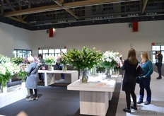 Presentation tables. Not the producer, but the product is in the foreground.