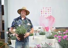 Dave Doolittle of PlantHaven holding the Dianthus American Pie.