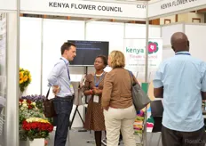 Jane Ngige if Kenya Flower Council talking with visitors.