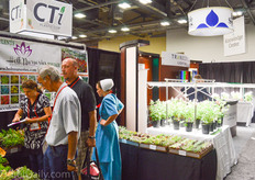 Debora Holt of Holt Nurseries talking with visitors.