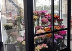 Several bouquets are presented in a display case.