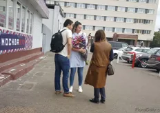 This lady is proud of her bunch of colorful lisianthus that she bought at the Riga Market.