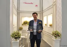 "Juan Camilo Herrera of Jardines de los Andes. This Colombian grower won the highest award 'Grand Champion' for its Charmelia over all other flowers in the competition and the first place for the "Best in Category"."