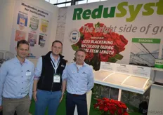 Mardenkro - Hans van Eijk, Yosef Gilles and Roger de Jagher standing next to the presentation of Reduflex Blue. ReduFlex Blue is a photo-selective coating which has a beneficial effect on the cultivation and production of cut roses because it transmits relatively less blue light than red light. It also reflects high levels of infrared radiation (heat).