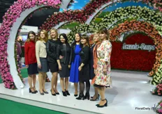 Ladies posing in front of the Ascania Flora booth