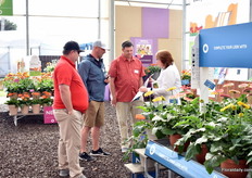 Judy Born of Florist talking with visitors.